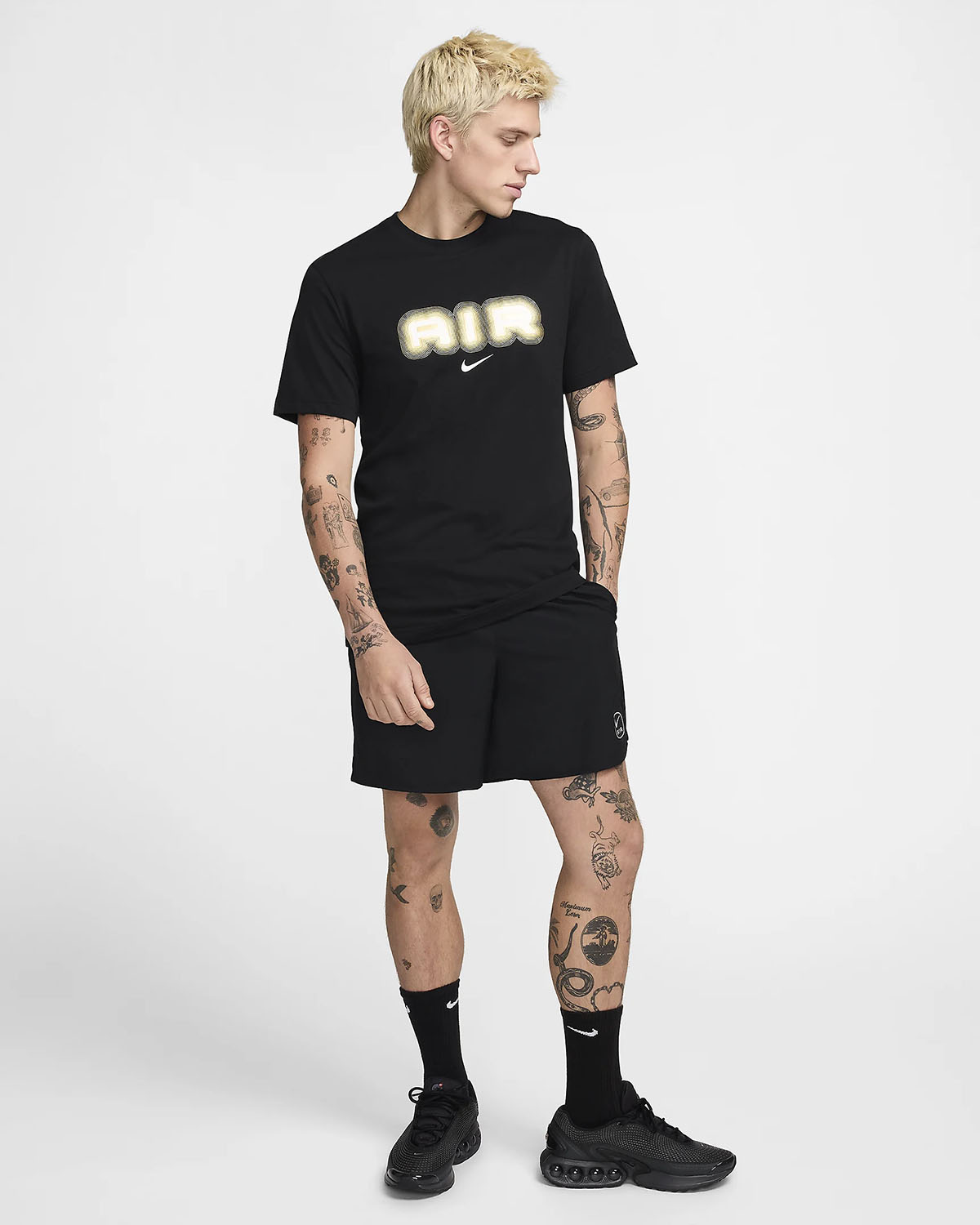 black white and gold nike shirt