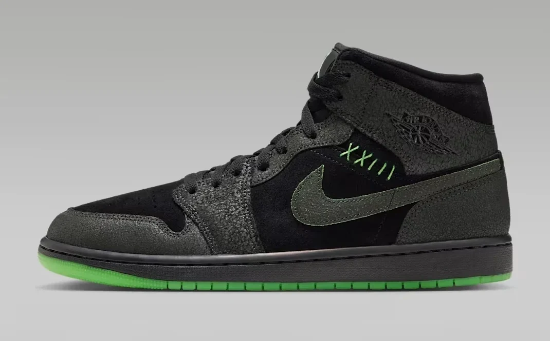 Side view of the Air Jordan 1 Mid SE Halloween in black and Sequoia with green stitching, a dark Nike Swoosh and bright green outsole.