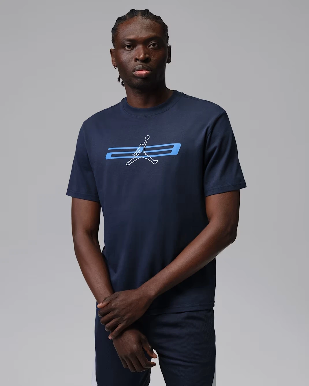 Jordan Sport Dri-FIT T-Shirt in Midnight Navy with University Blue Jumpman graphic matching the Air Jordan 13 "Flint" (2026).