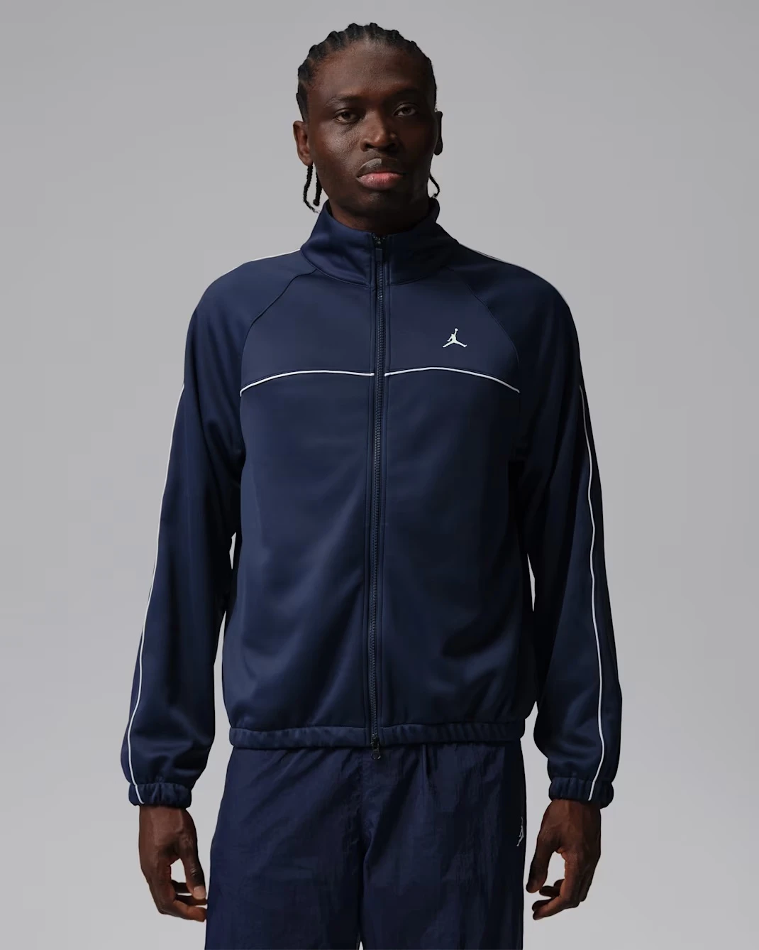 Jordan Jumpman Track Jacket in Midnight Navy with white piping matching the Air Jordan 13 "Flint" (2026).