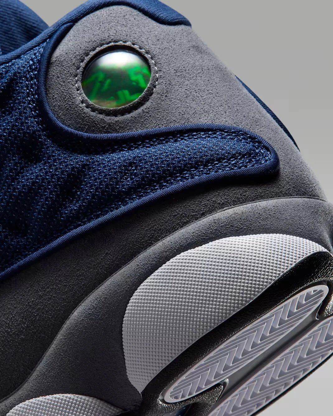 Close-up of the holographic cat-eye on the Air Jordan 13 "Flint" (2026).