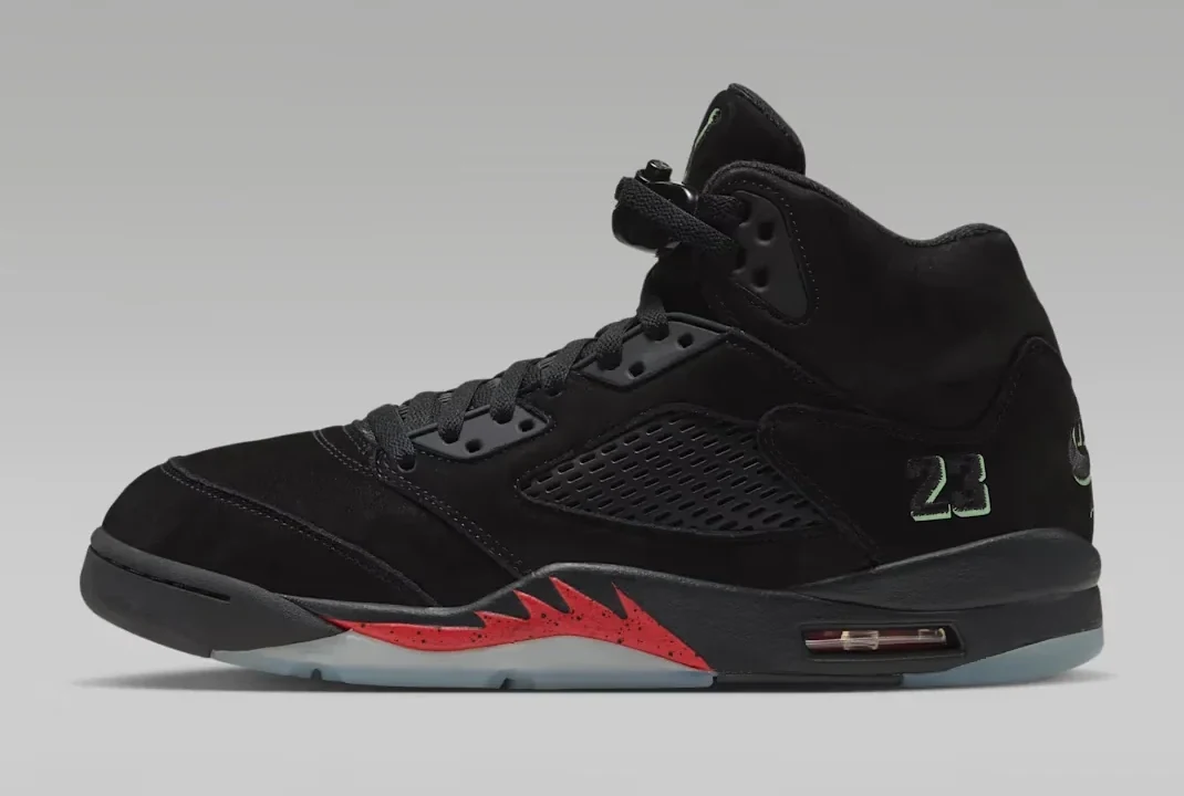 Side view of the black Air Jordan 5 Retro Halloween sneaker with Picante Red midsole accents and glow-in-the-dark details.