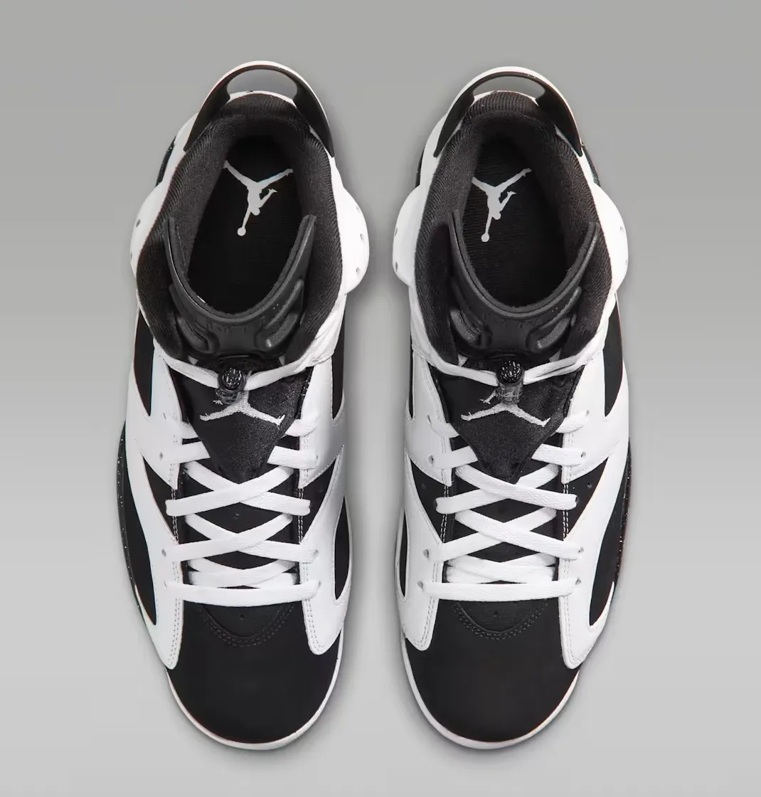 Top view of the Air Jordan 6 “Oreo” (2026) pair with white laces and black tongues.