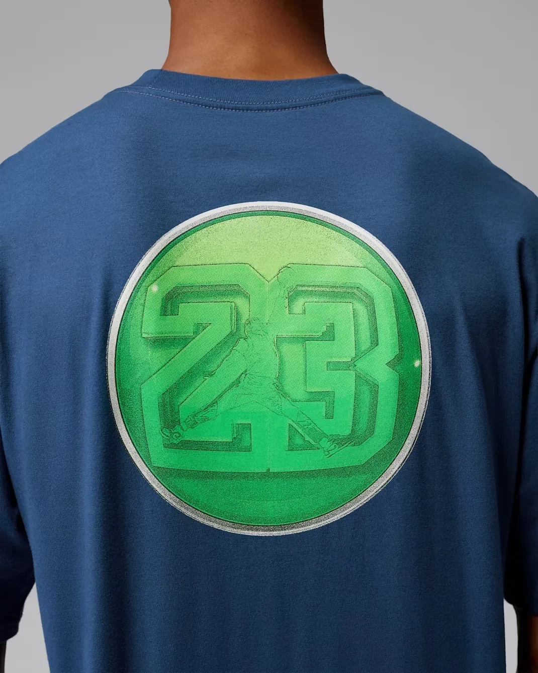 Close-up of the AJ23 back graphic on the French Blue Jordan AJ13 T-Shirt.