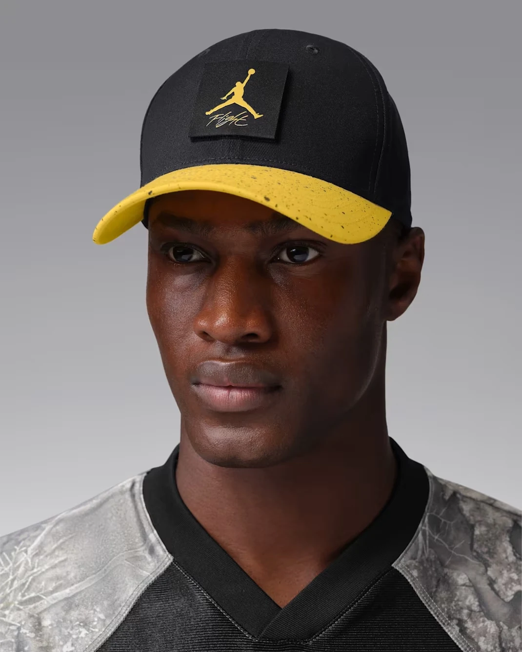 Black and Tour Yellow Jordan AJ4 Rise cap with Jumpman Flight patch