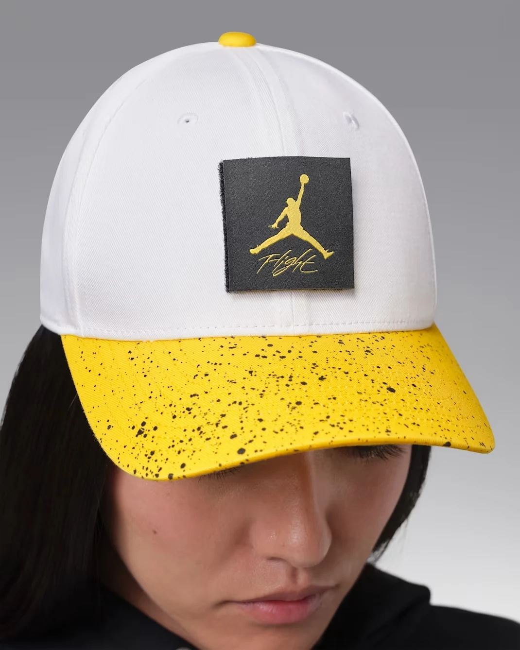 White and Tour Yellow Jordan AJ4 Rise cap with Jumpman Flight patch and speckled brim