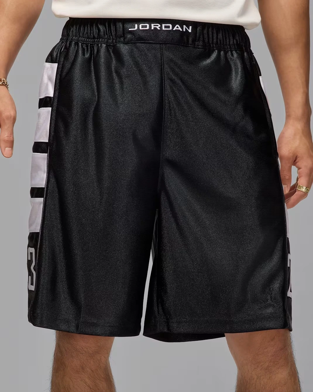 Black Jordan Brooklyn Cat Scratch men's shorts with white side graphics and number 23 details