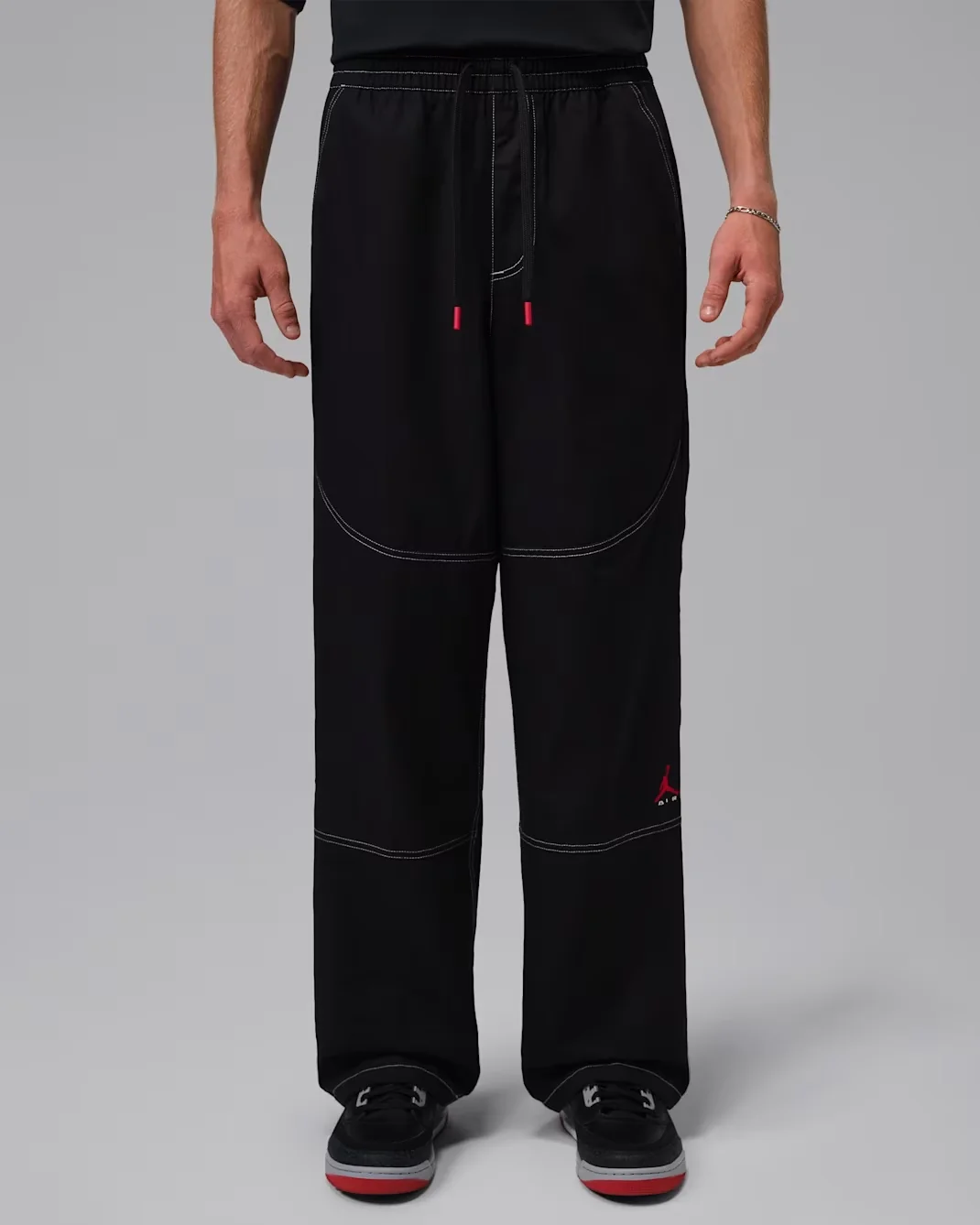Jordan Brooklyn Chino Pants in Black with University Red accents