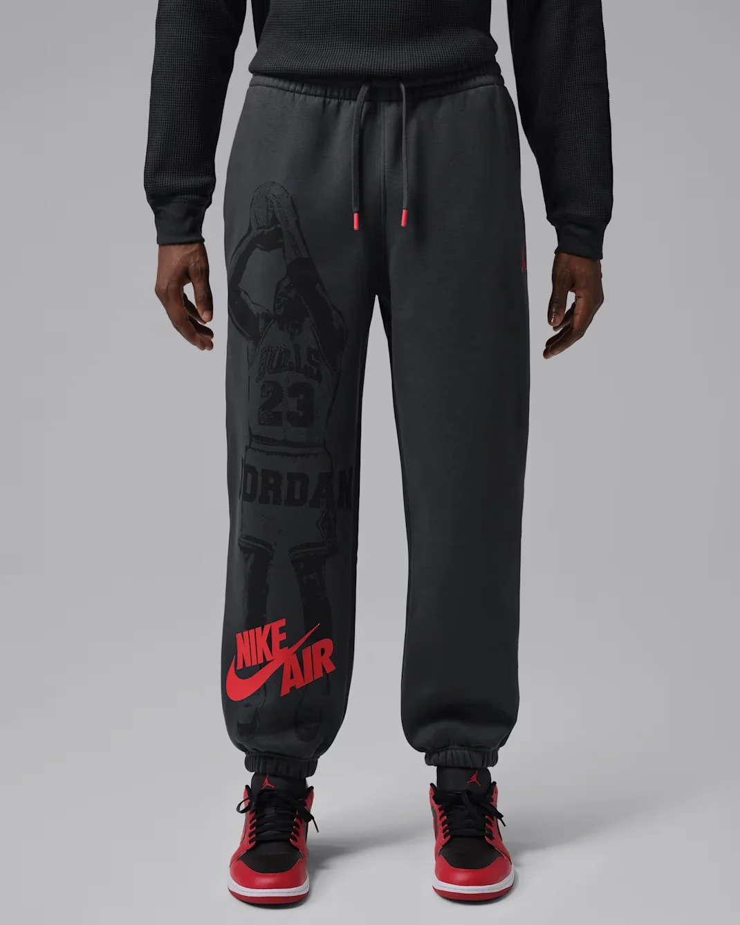 Jordan Brooklyn Fleece Cuffed Pants in Black with Gym Red Nike Air graphic