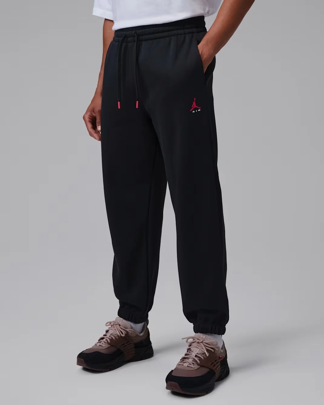 Jordan Brooklyn Fleece Cuffed Pants in Black with University Red accents