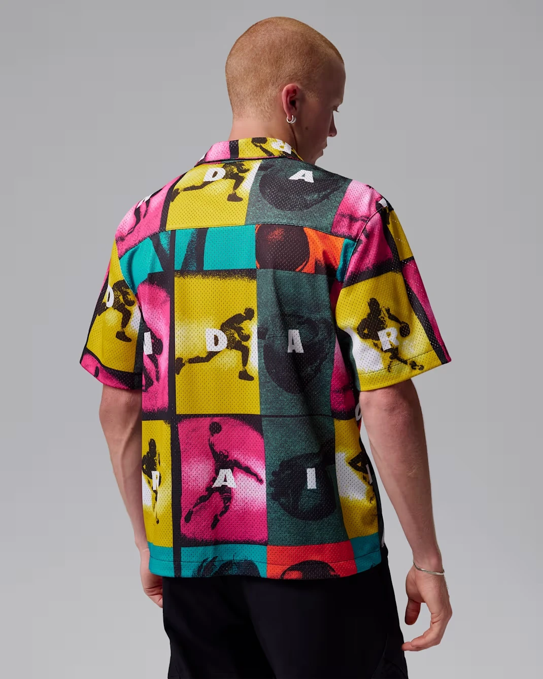 Back view of the Jordan Brooklyn Graphic Shirt featuring colorful comic-inspired artwork.