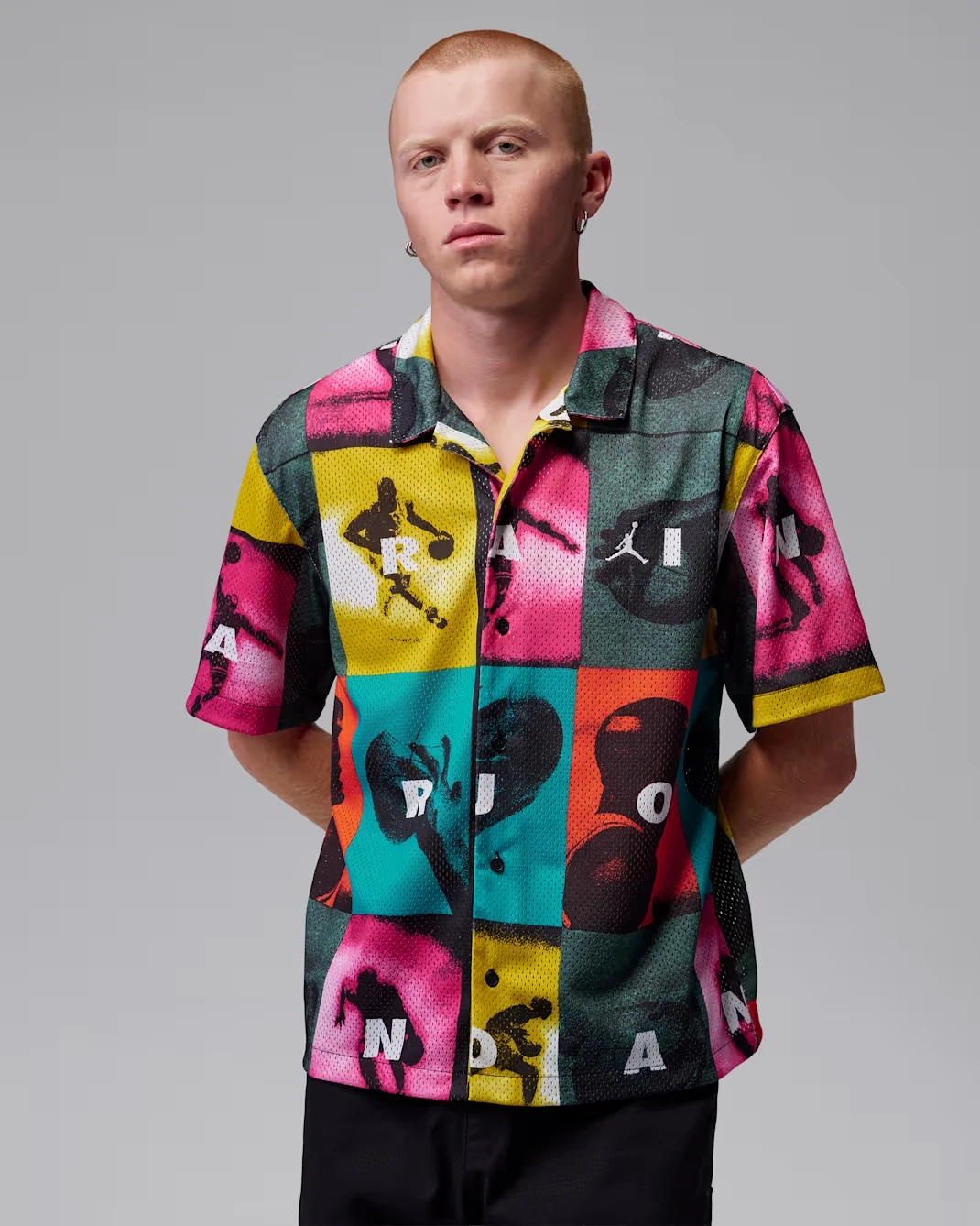 Front view of the Jordan Brooklyn Graphic Shirt featuring colorful comic-inspired graphics.