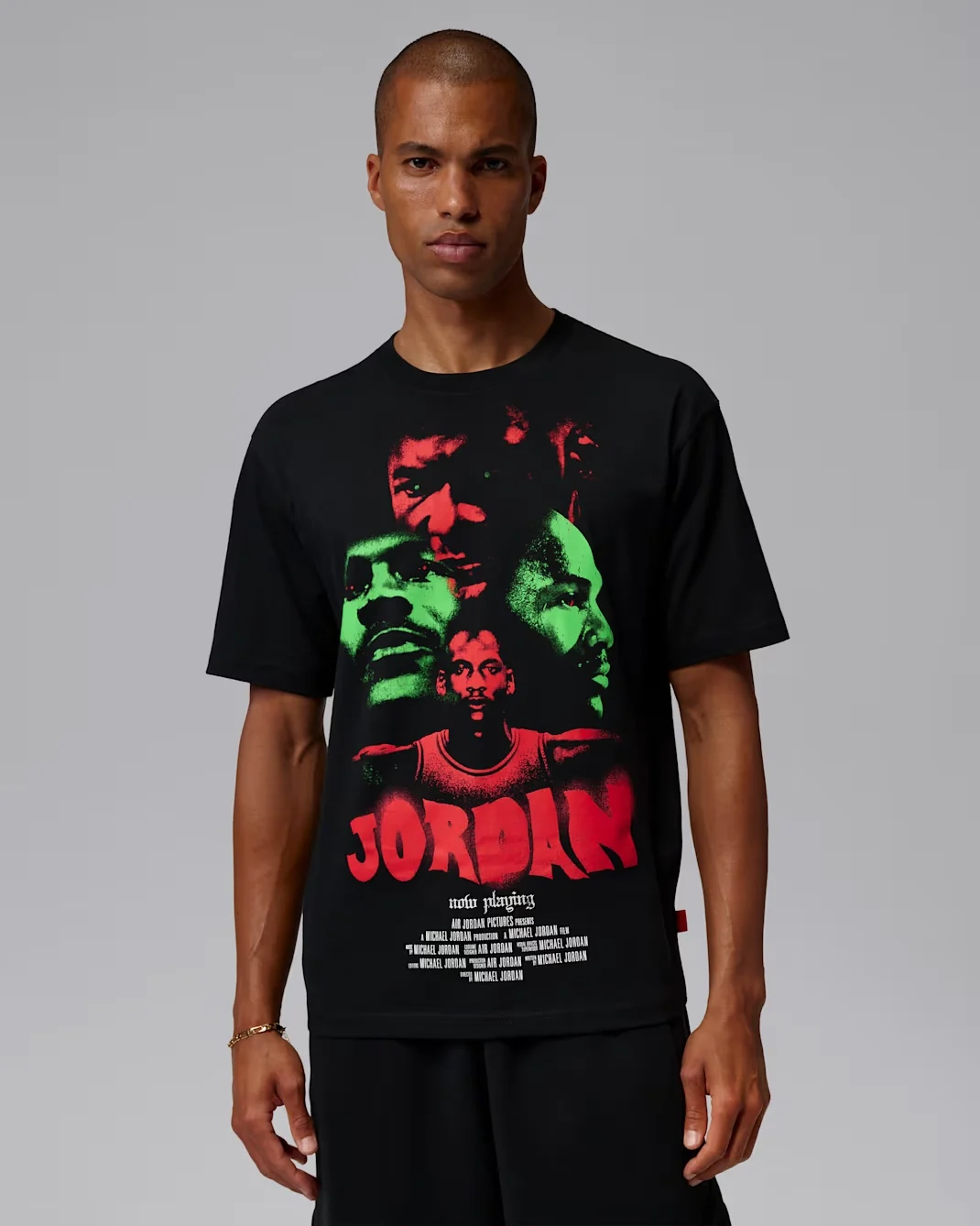 Model wearing a black Jordan Brooklyn T-shirt featuring a red and green Michael Jordan graphic inspired by vintage horror movie posters.