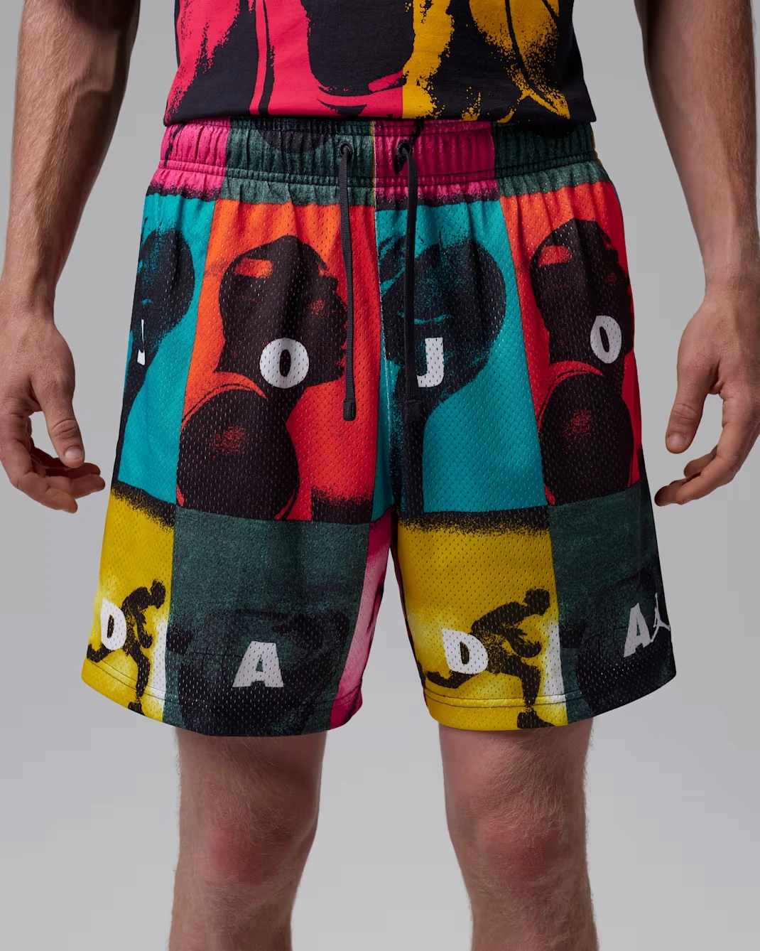 Front view of Jordan Brooklyn Mesh Shorts featuring a colorful comic-inspired all-over print.