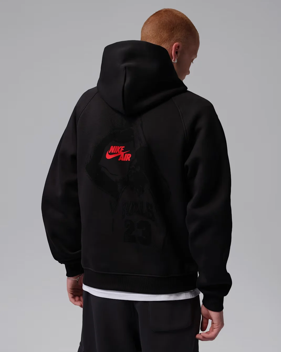 Back view of Jordan Brooklyn Pullover Hoodie in Black with Gym Red Nike Air graphic