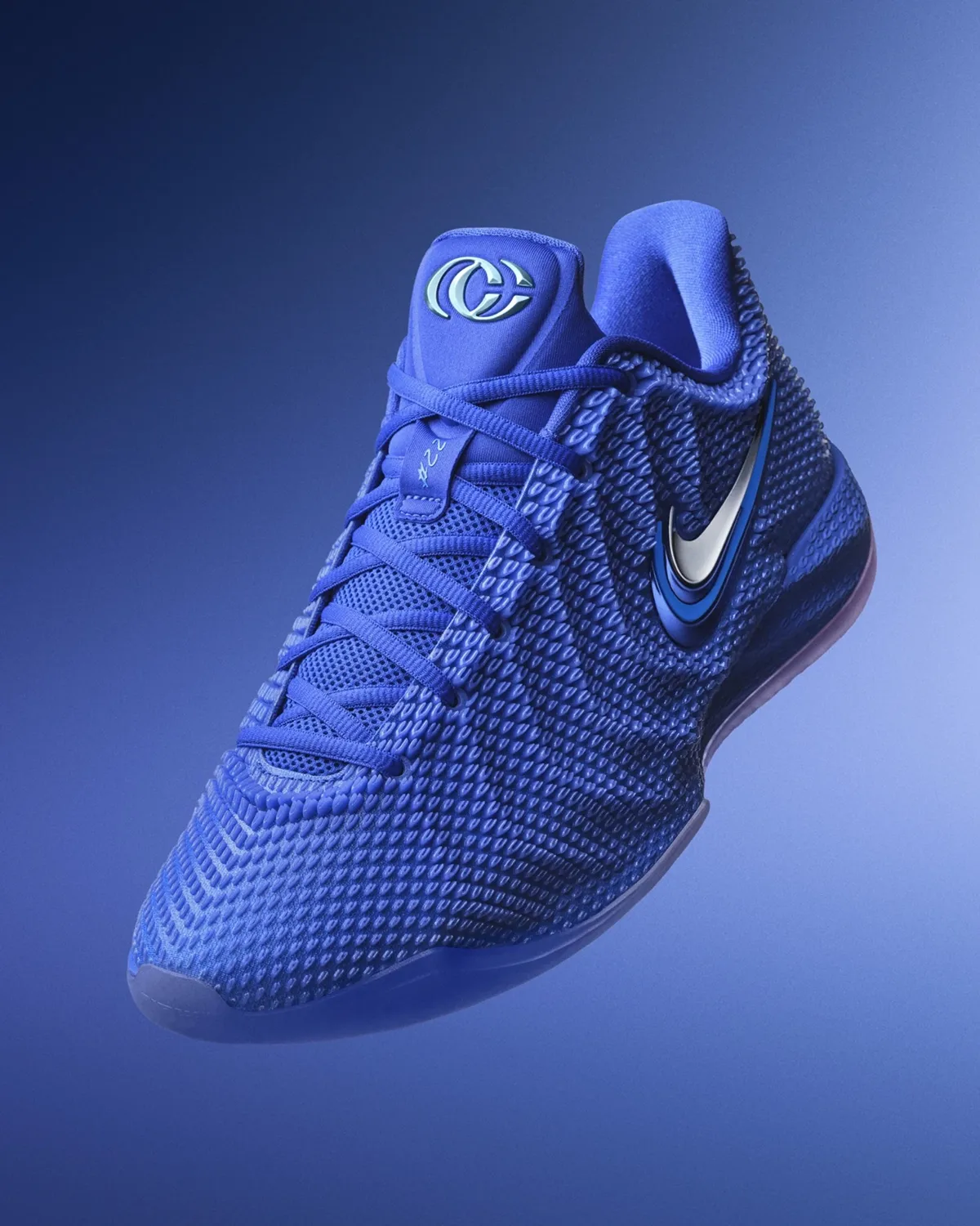 Nike Caitlin 1 Caitlin Blue basketball shoe in royal blue with silver and blue Swoosh details on a blue background.