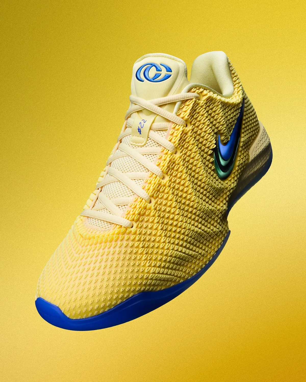 Nike Caitlin 1 Warning Code basketball shoe in yellow with blue accents on a yellow background.