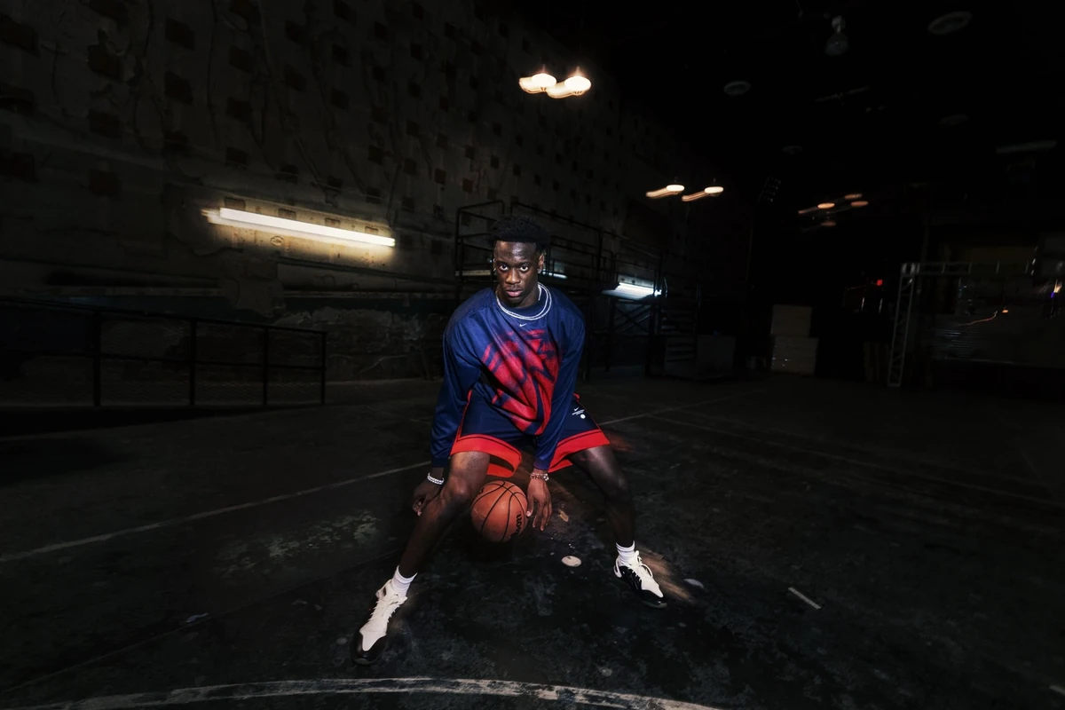 AJ Dybantsa wearing navy and red Nike NBA Standard Issue basketball apparel
