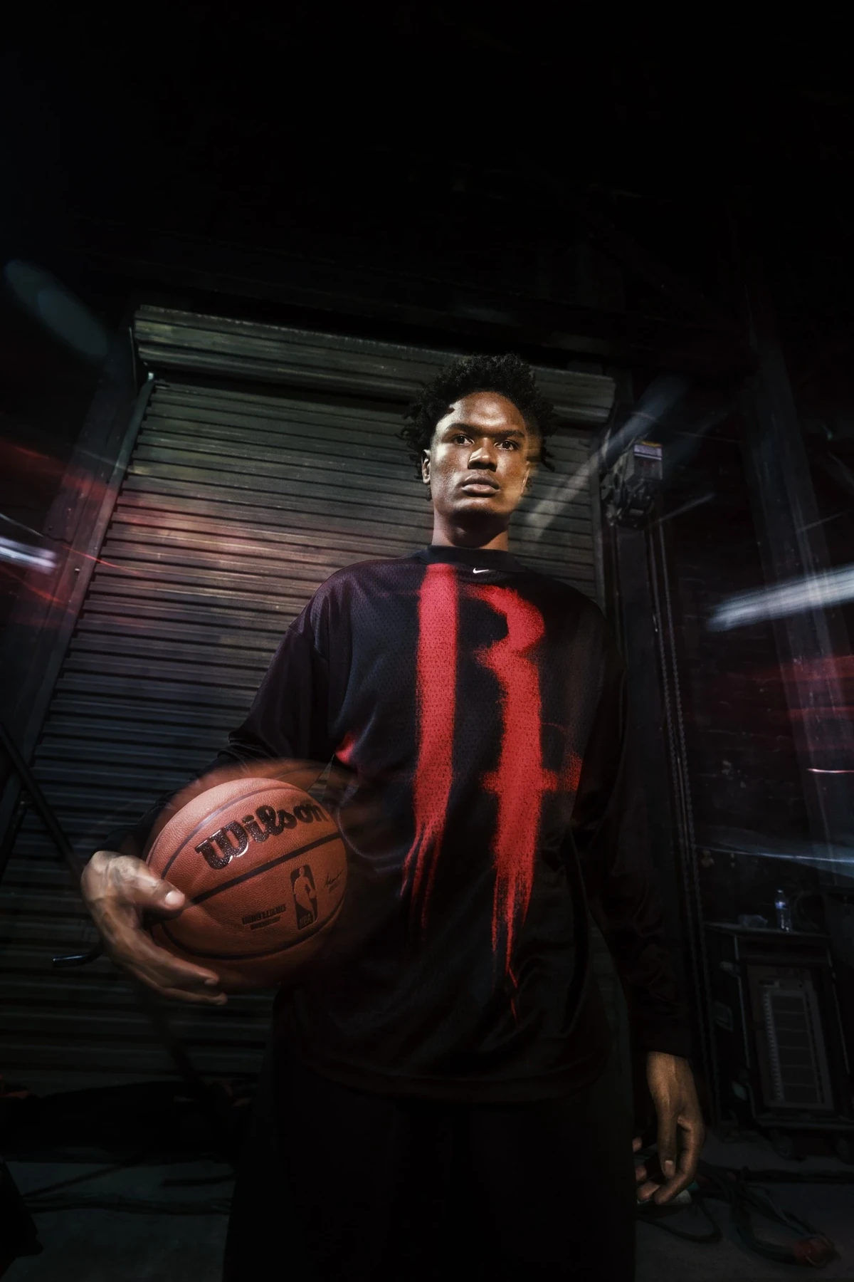 Amen Thompson wearing black and red Nike NBA Standard Issue basketball apparel