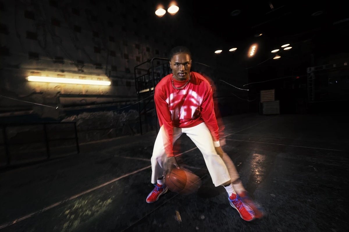 Ausar Thompson wearing red and white Nike NBA Standard Issue basketball apparel