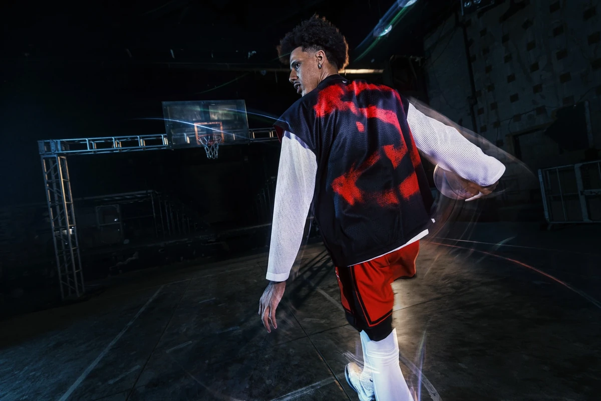 Jalen Johnson wearing black, red and white Nike NBA Standard Issue basketball apparel